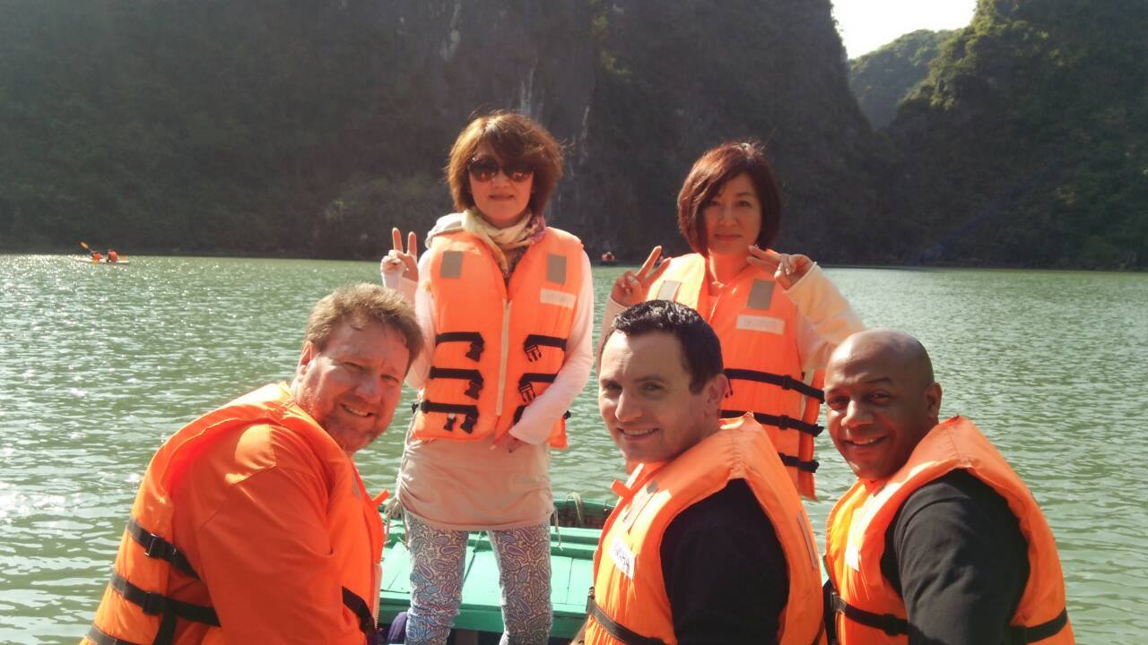 Part of tour group heading to caves Ha Long Bay Vietnam two UK guys 40th birthday two Japanese grandmothers