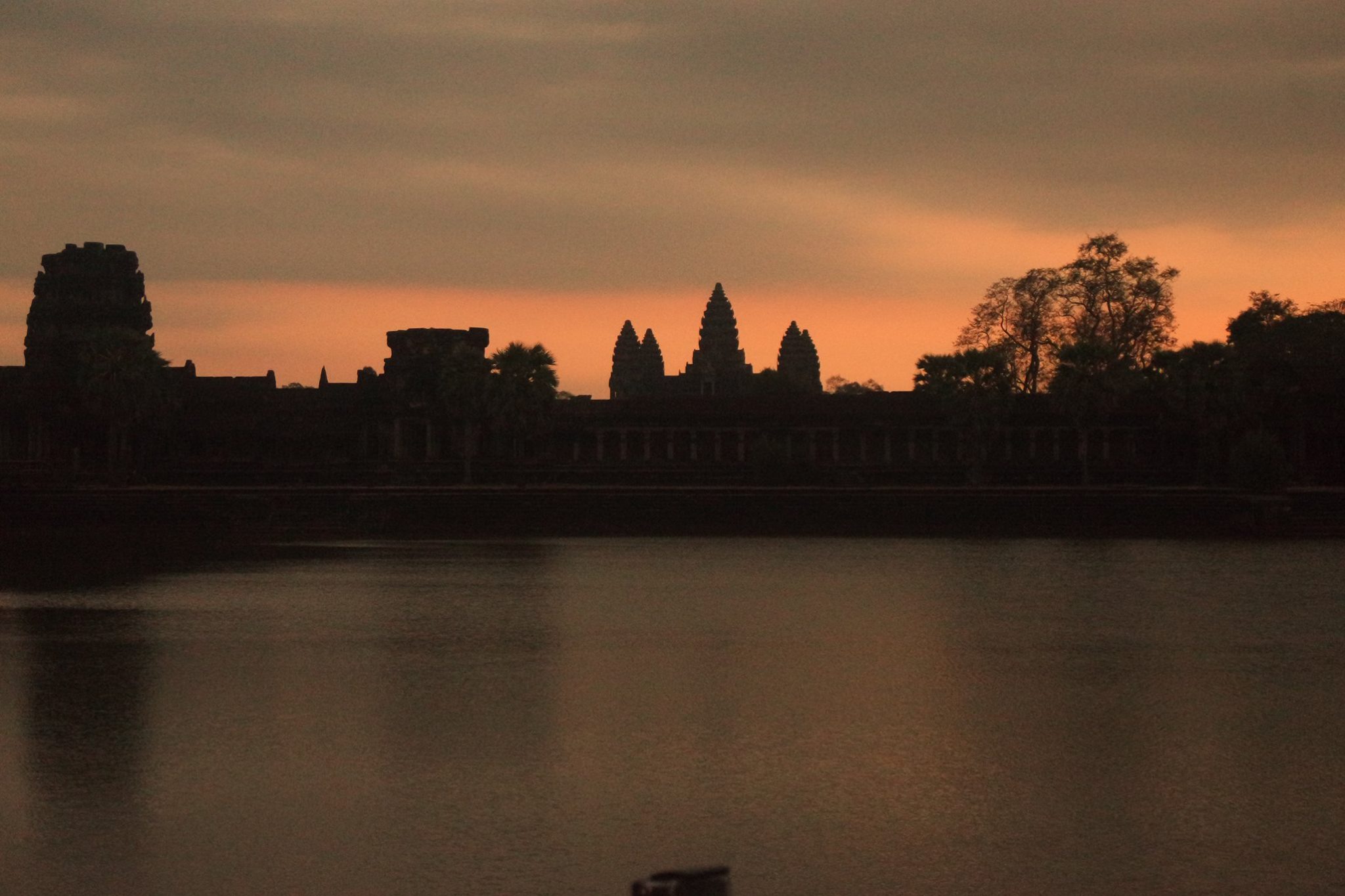 Sunrise at Angkor Wat Cambodia reflection pool temples