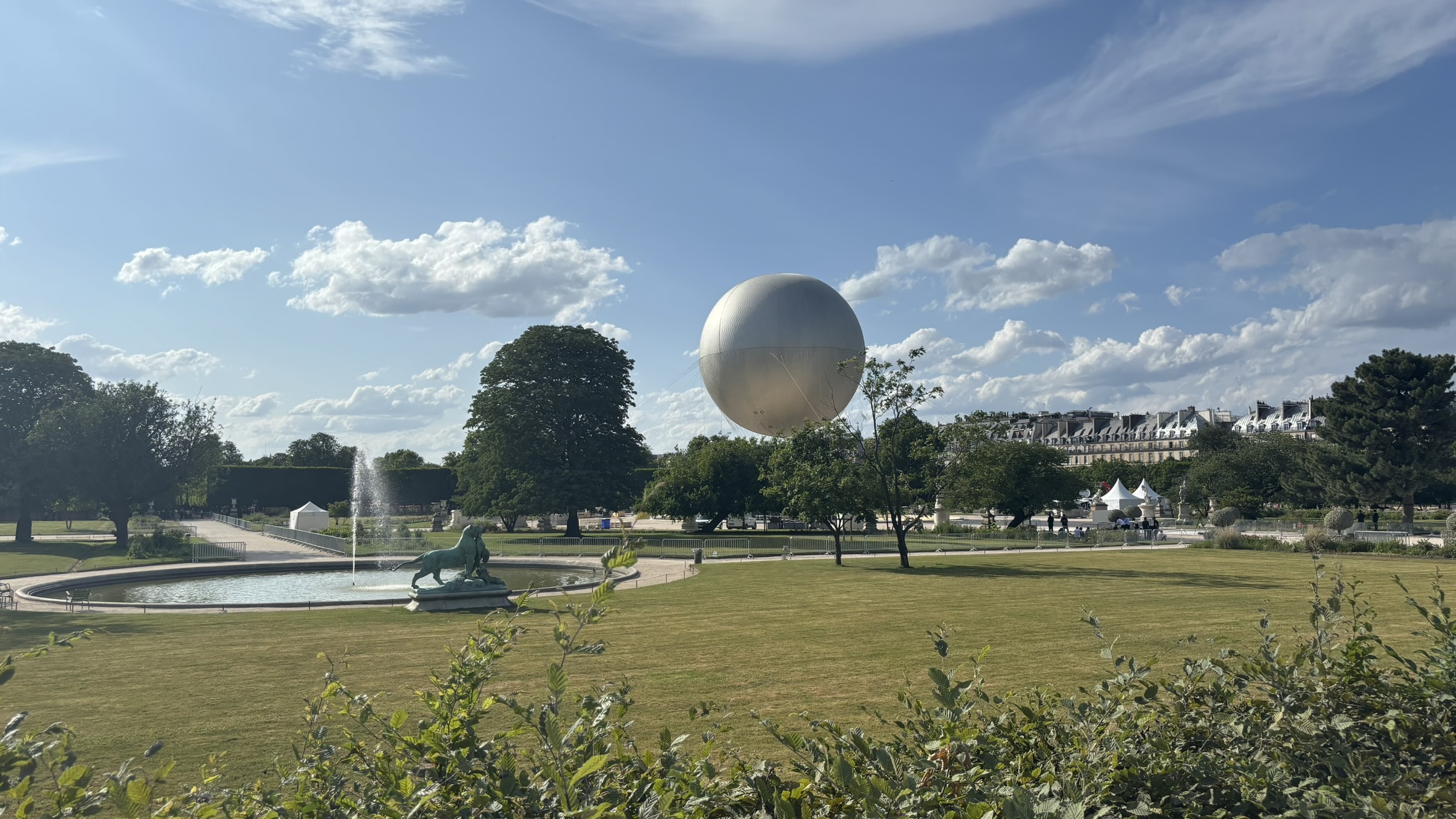 Walking from Louvre towards Arc Olympic flame structure Paris